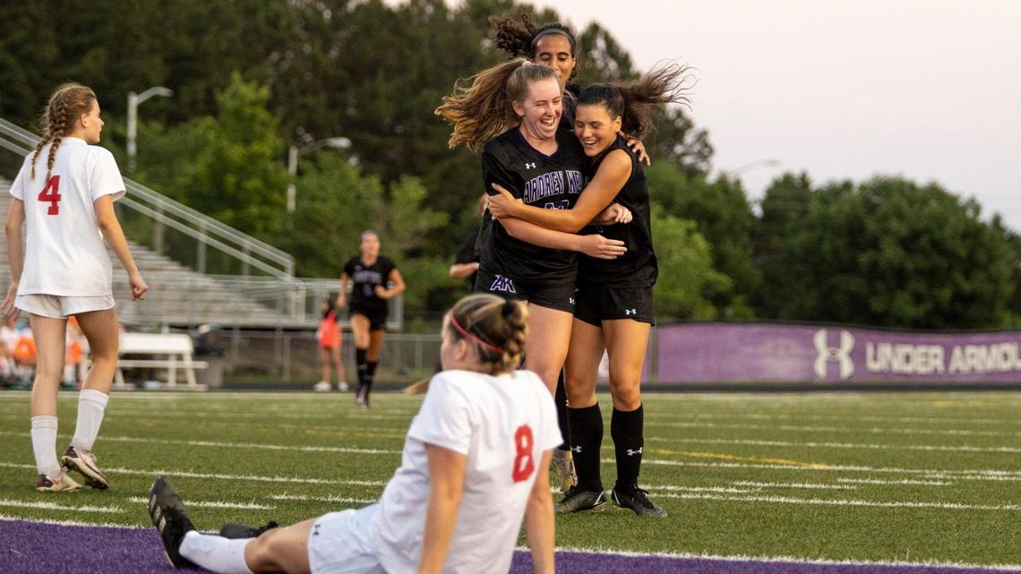 Ardrey Kell’s Taylor Suarez, center, Ally Casey, celebrate after Avery Richards scored a goal against Page High School during the NCHSAA girls soccer semifinals at Ardrey Kell School on Tuesday, May 31, 2022.
