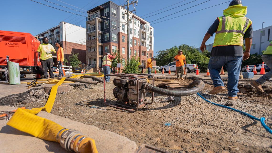 Workers with Charlotte Water continue work at the site of a broken water main on Central Avenue near Lamar Avenue in Plaza Midwood Tuesday morning, July 19, 2022. According to Jim Davidson, Cheif Construction Inspector for Charlotte Water, crews performed repairs on a waterline, sewer line, and storm drain line.