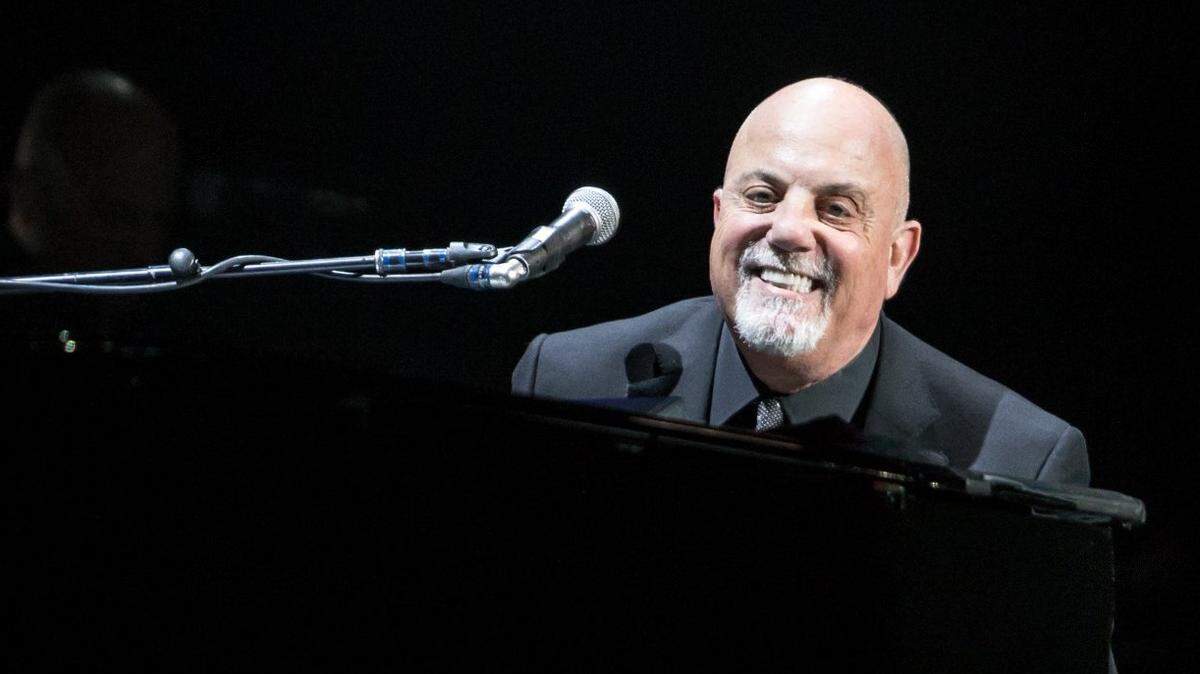 Billy Joel smiles at the crowd while performing at Time Warner Cable Arena in Charlotte on Dec. 5, 2015.