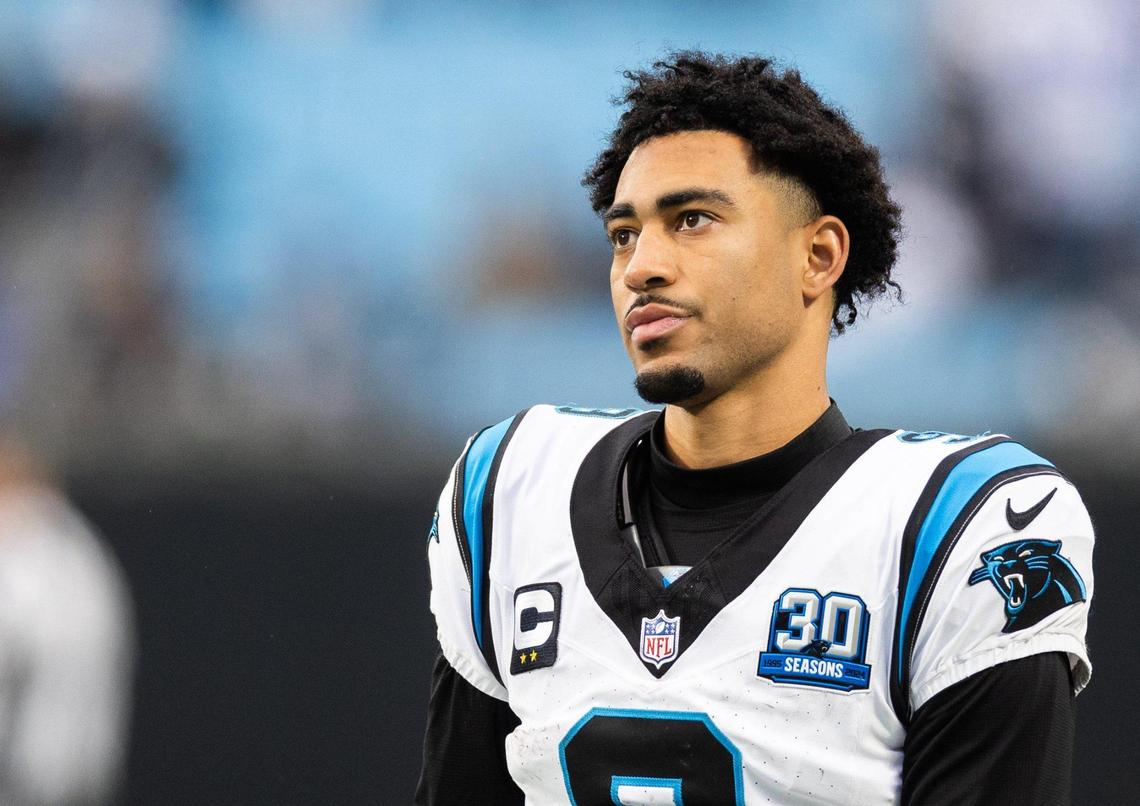 Carolina Panthers quarterback Bryce Young stands on the sidelines at the Bank of America Stadium in Charlotte, N.C., on Sunday, December 15, 2024.