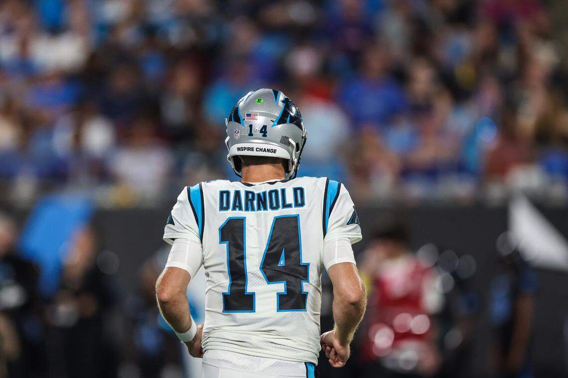 Panthers quarterback Sam Darnold jogs off the field during the game against the Bills at Bank of America Stadium on Friday, August 26, 2022 in Charlotte, NC.