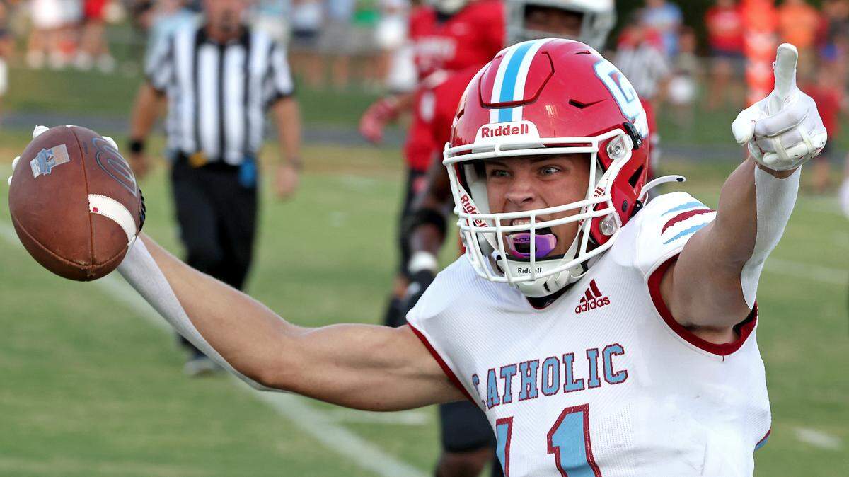 Charlotte Catholic wide receiver Nick Bierman begins to celebrate as he runs into the end zone during first half action against the South Meck Sabres on Friday, August 18, 2023 at South Meck High School. Unfortunately for Bierman and the Cougars, a penalty was called on the play.