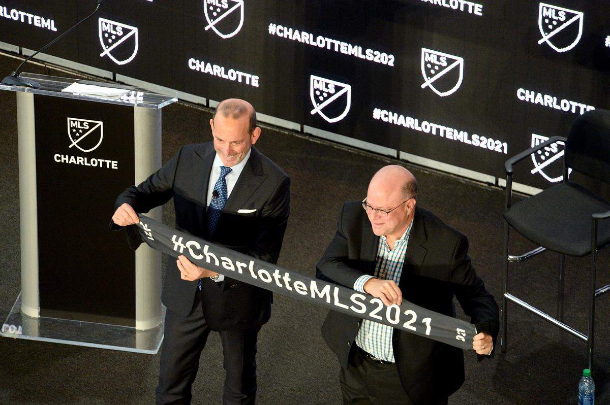 Don Garber, MLS commissioner and David Tepper, team owner, show off the Charlotte 2021 scarf as they announced the city as the 30th team in Major League soccer.