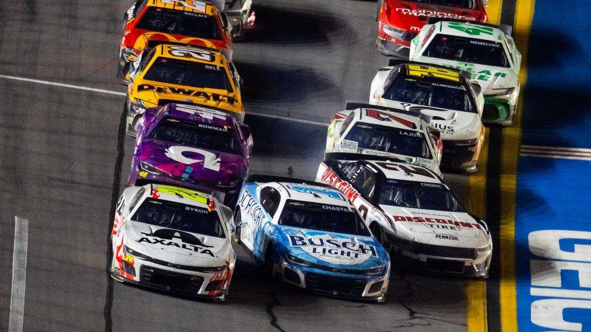 Feb 19, 2024; Daytona Beach, Florida, USA; NASCAR Cup Series driver William Byron (24) leads the field as Ross Chastain (1) and Austin Cindric (2) crash coming to the white flag during the Daytona 500 at Daytona International Speedway.