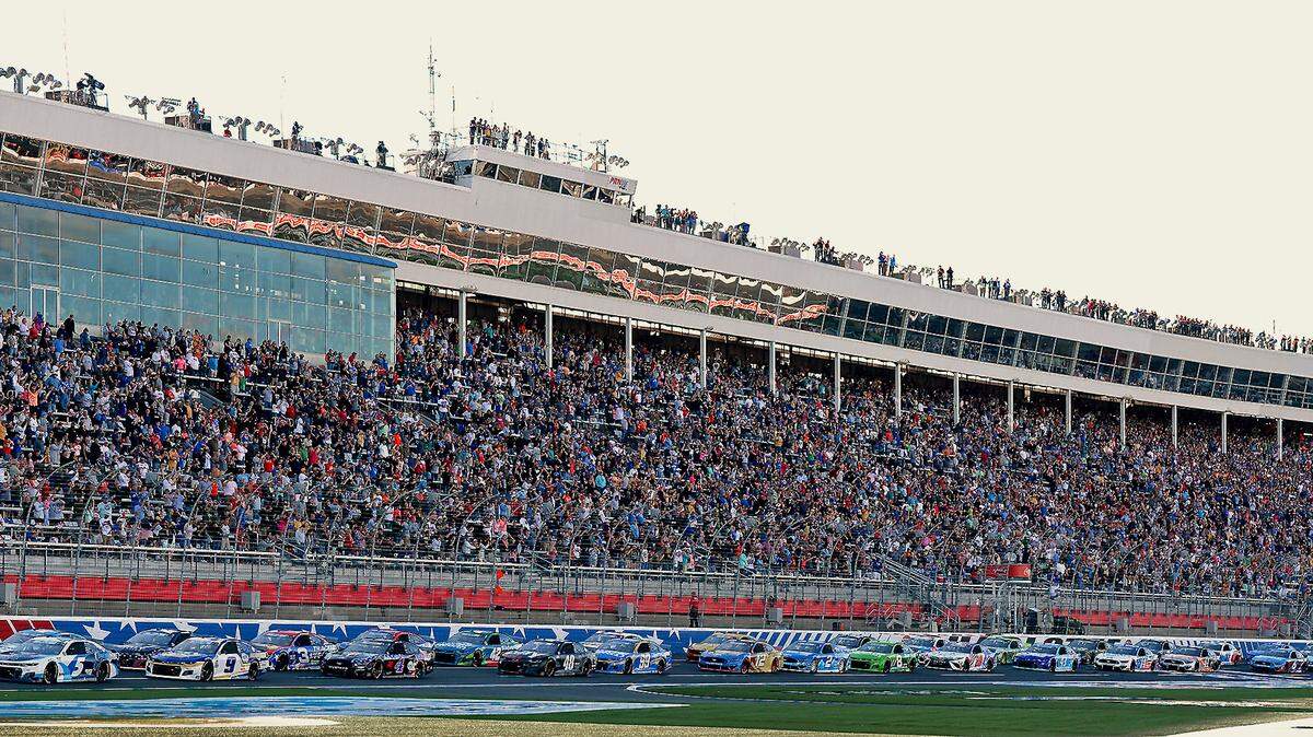The field in the Coca-Cola 600 passes by the front grandstand at Charlotte Motor Speedway on Sunday, May 30, 2021.