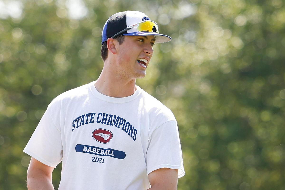Charlotte Christian’s Judd Utermark jokes with teammates during practice at Charlotte Christian School in Charlotte, N.C., Wednesday, April 27, 2022. This season Utermark broke a 22-year old school record for home runs and as of Monday, April 25 he leads the nation win home runs.
