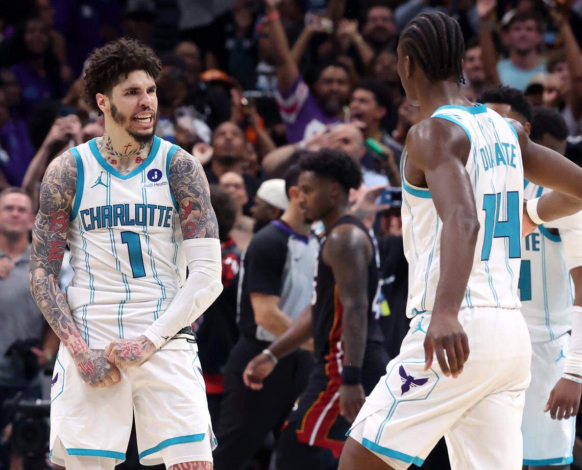 Charlotte Hornets guard LaMelo Ball, left, celebrates a basket with his teammate forward/center Moussa Diabate, right, during action against the Miami Heat at Spectrum Center in Charlotte, NC on Tuesday, April 14, 2026. The Hornets defeated the Heat 127-126 in NBA Play-in-Tournament basketball game.