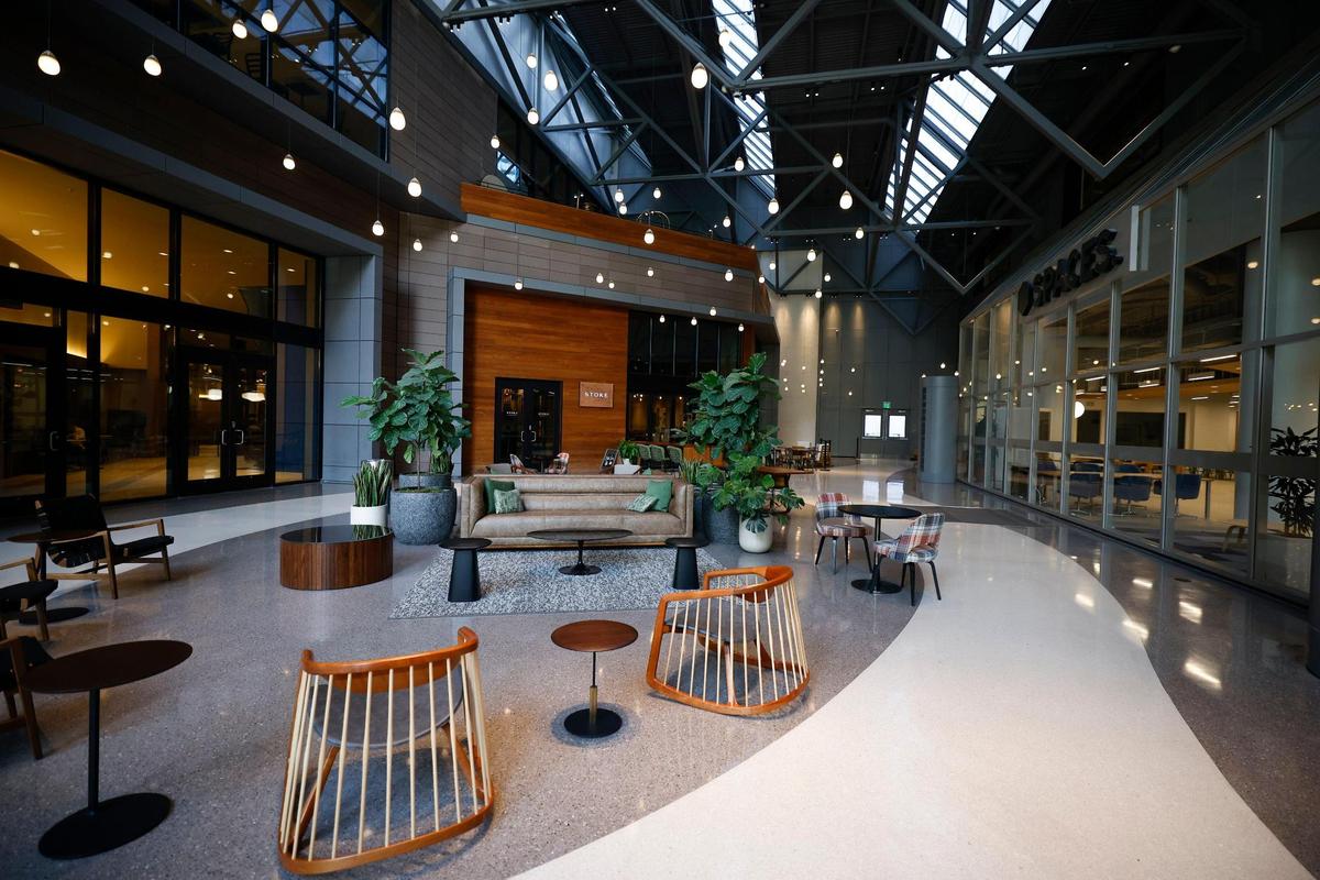 The lobby at One Independence Center. Crescent Communities, a local developer, partnered with Nuveen Real Estate, to bring in new furniture and lighting to make the space more inviting.
