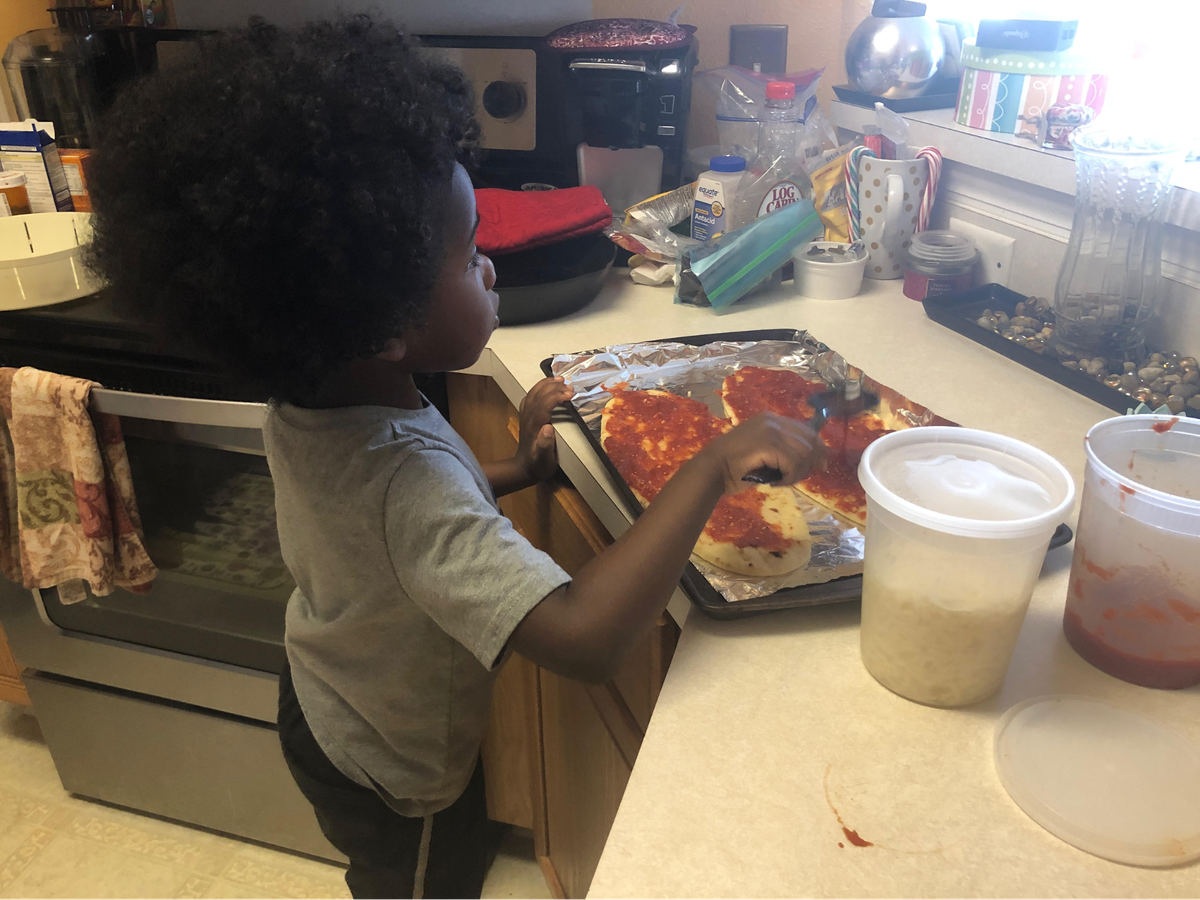Making pizzas for lunch with mom Ashley Roseboro is an activity that her preschooler, Kam, looks forward to.