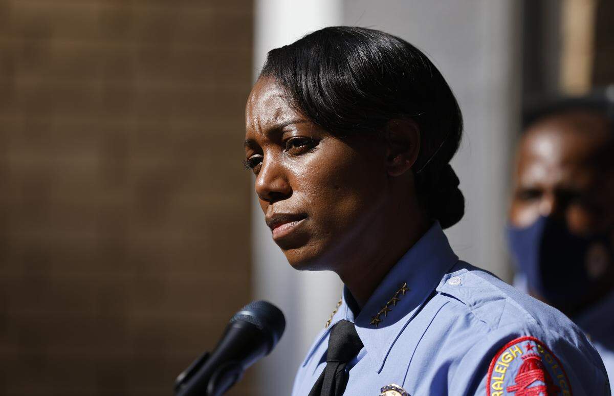 Then-Raleigh Police Chief Estella Patterson listens to a question during a press event outside the Northwest District office in Raleigh on Oct. 13, 2021.