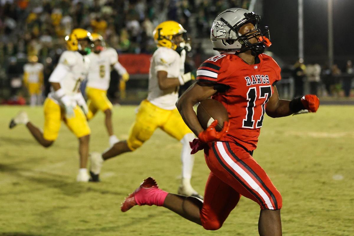 Butler junior Keyshawn Barrino (17) runs for the end zone in the fourth quarter against Independence at Butler High School on October 27, 2023. The junior scores the last touchdown for the Bulldogs to claim the Southwest 4A title over the Patriots, 35-23.