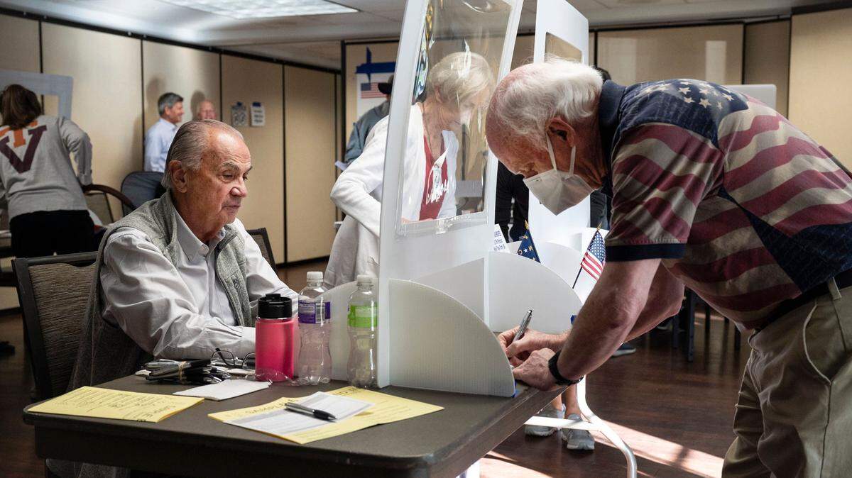 Voters check-in to cast their ballots for mid-term elections at Covenant Presbyterian Church on Tuesday, November 8, 2022.