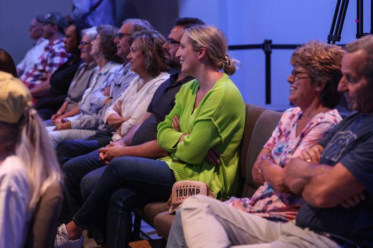 Supporters listen as Senator JD Vance, the GOP vice presidential candidate, speaks during a rally at Freedom House Church in Charlotte, NC on Monday, September 23, 2024.