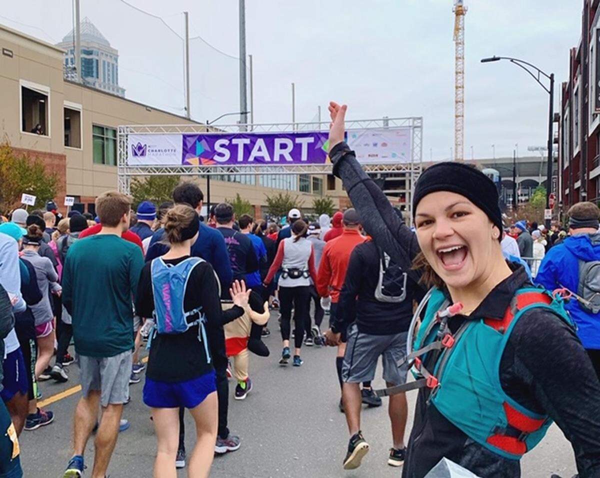 Beth McMillan ran Charlotte Marathon in 2019 (shown above, before COVID-19). In 2020, she helped a friend run a virtual race by pacing her through miles 16-26.2, when runners typically “hit the wall”.