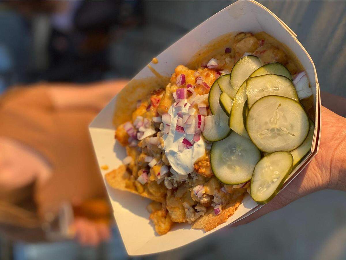 The Hangar’s Trash Nachos tout that it includes “every meat you can imagine,” plus tots, housemade beer cheese, ranch, sour cream, onion and pickes on the side.