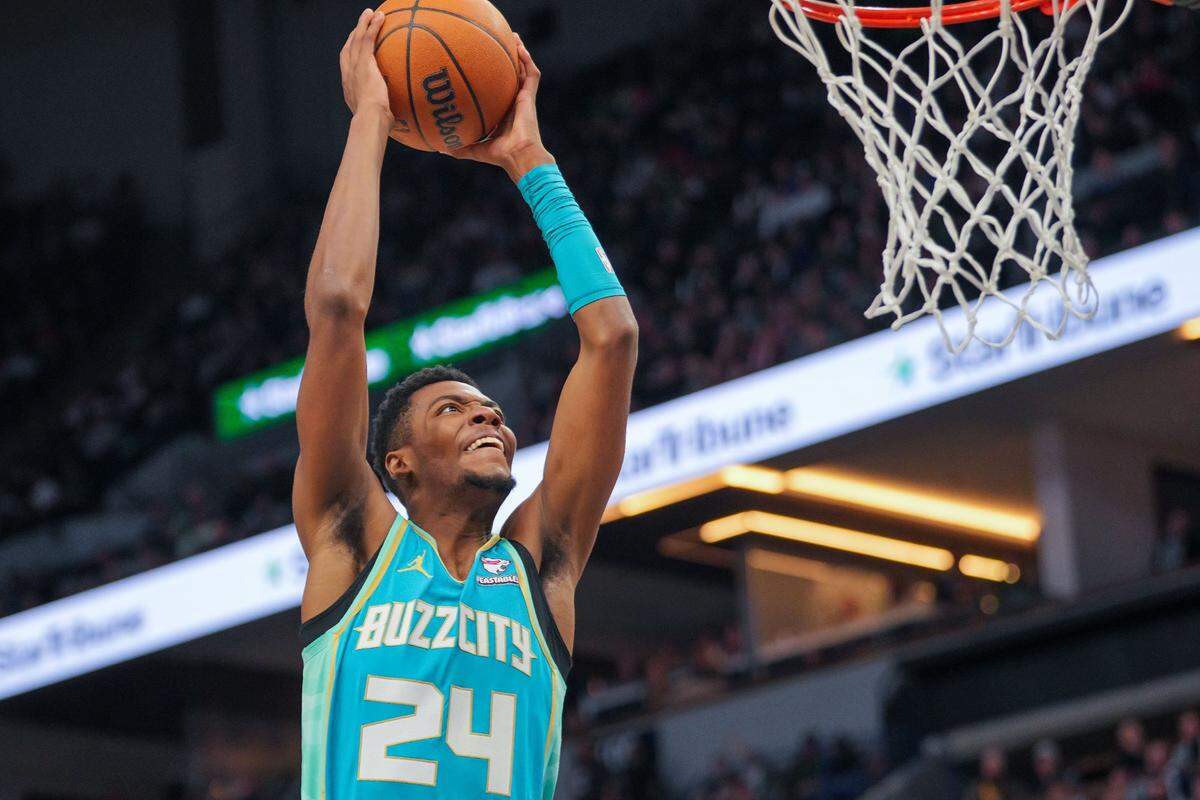 Charlotte Hornets forward Brandon Miller (24) dunks against the Minnesota Timberwolves in the third quarter at Target Center.