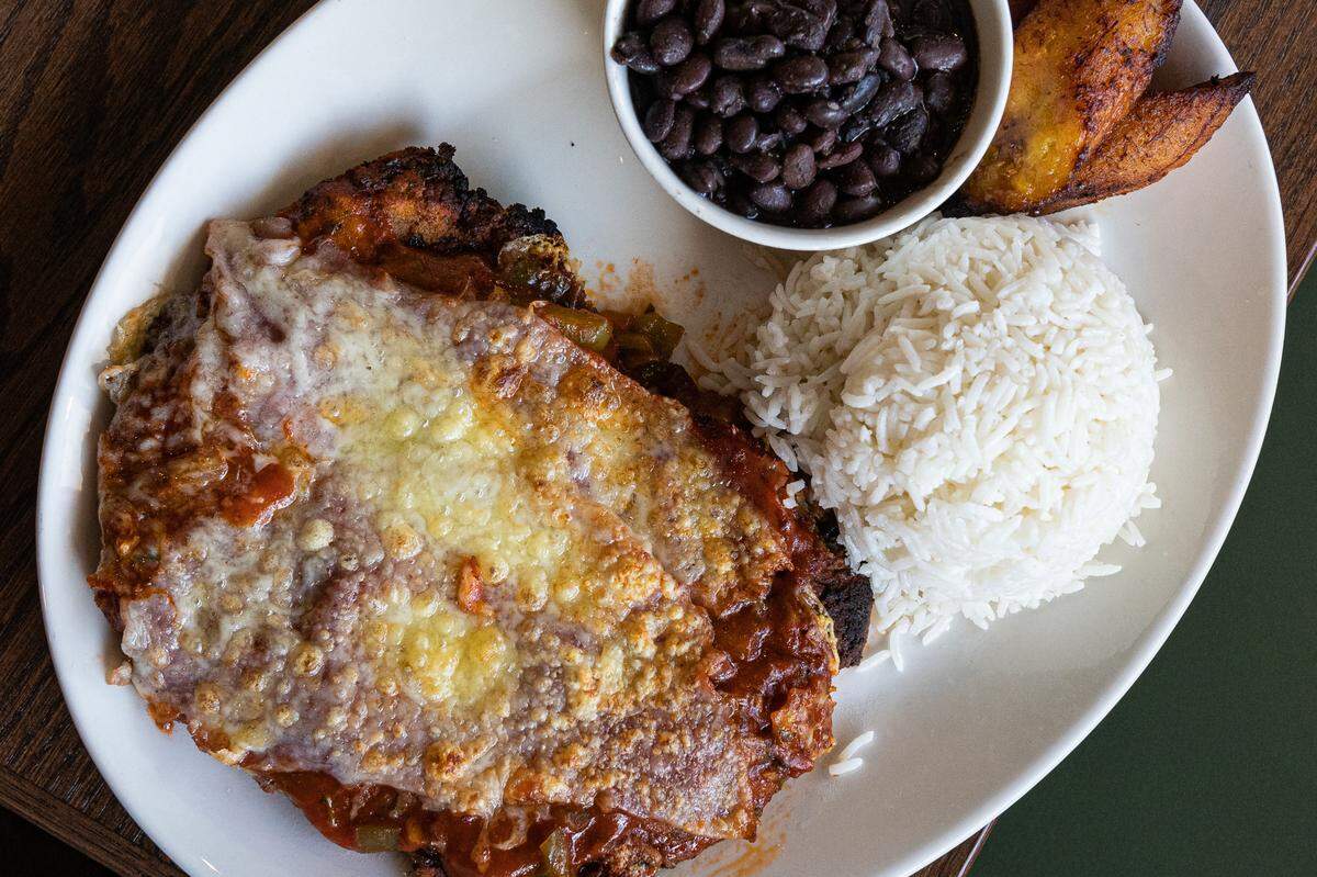 Calle Sol’s Milanesa is served with rice, beans and sweet plantains.