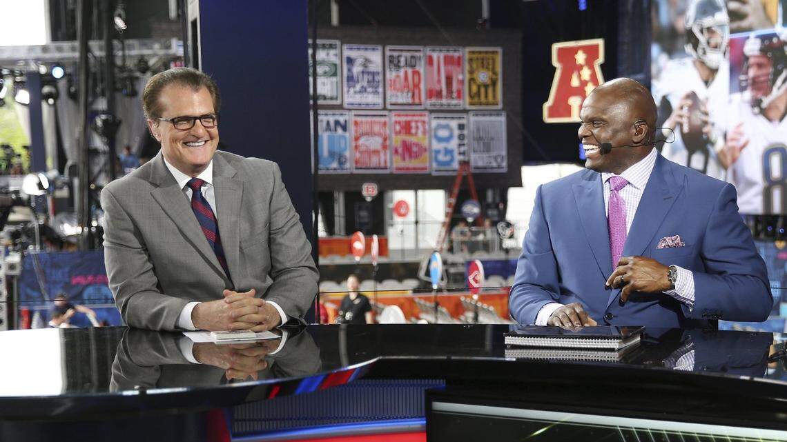 From left, Mel Kiper Jr., Booger McFarland, and Louis Riddick are seen on the set of ESPN SportsCenter, Wednesday, April 24, 2019, in Nashville, Tenn. (AP Photo/Steve Luciano)