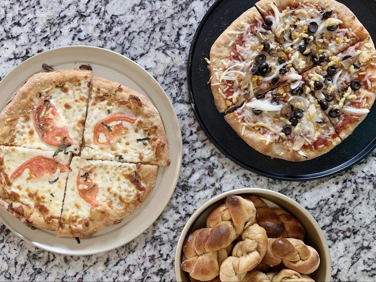 The perfect combination of crust and toppings is just right for “the big day.” Amanda Peschek and her partner plan to order from The Pizza Peel for their upcoming micro-wedding.