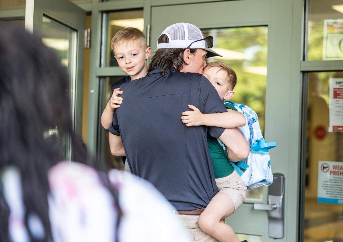 Students arrive for the first day of school at Elizabeth Traditional School in Charlotte, N.C., on Monday, August 25, 2025.