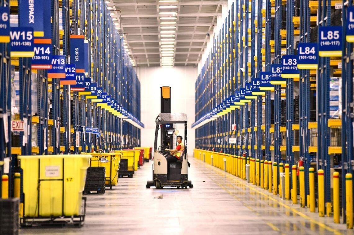 A General Motors employee drives a hi-lo to move and deliver parts throughout one of its parts distribution centers. GM is investing $23 Million in its Charlotte Parts Distribution Center to prepare for industry growth.