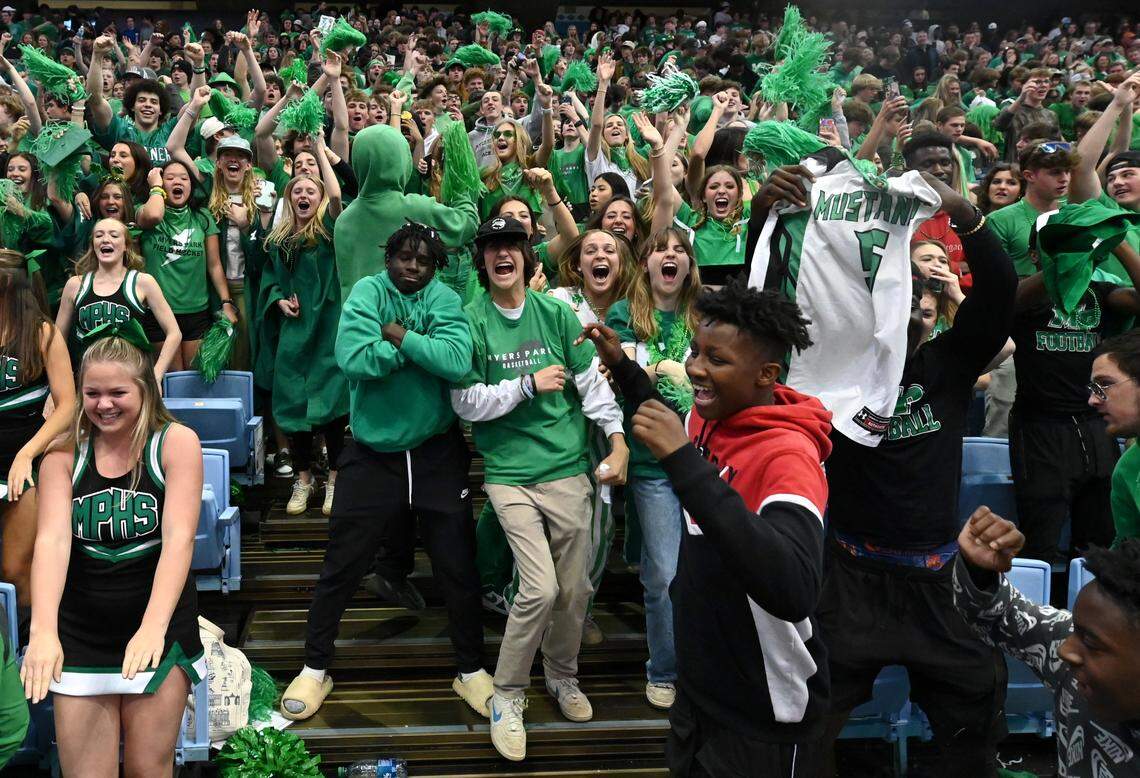 Myers Park students celebrate the boys basketball teams 74-60 victory over Richmond Senior in the NCHSAA state 4A championship game at the Dean Smith Center on Saturday, March 11, 2023.