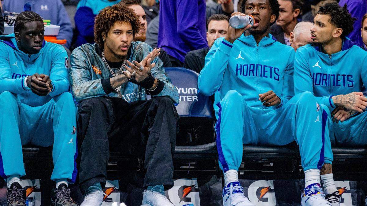 Charlotte Hornets guard Kelly Oubre Jr. (12) watches from the bench during the first half of an NBA basketball game on Wednesday, Jan. 4, 2023, in Charlotte, N.C. (AP Photo/Scott Kinser)