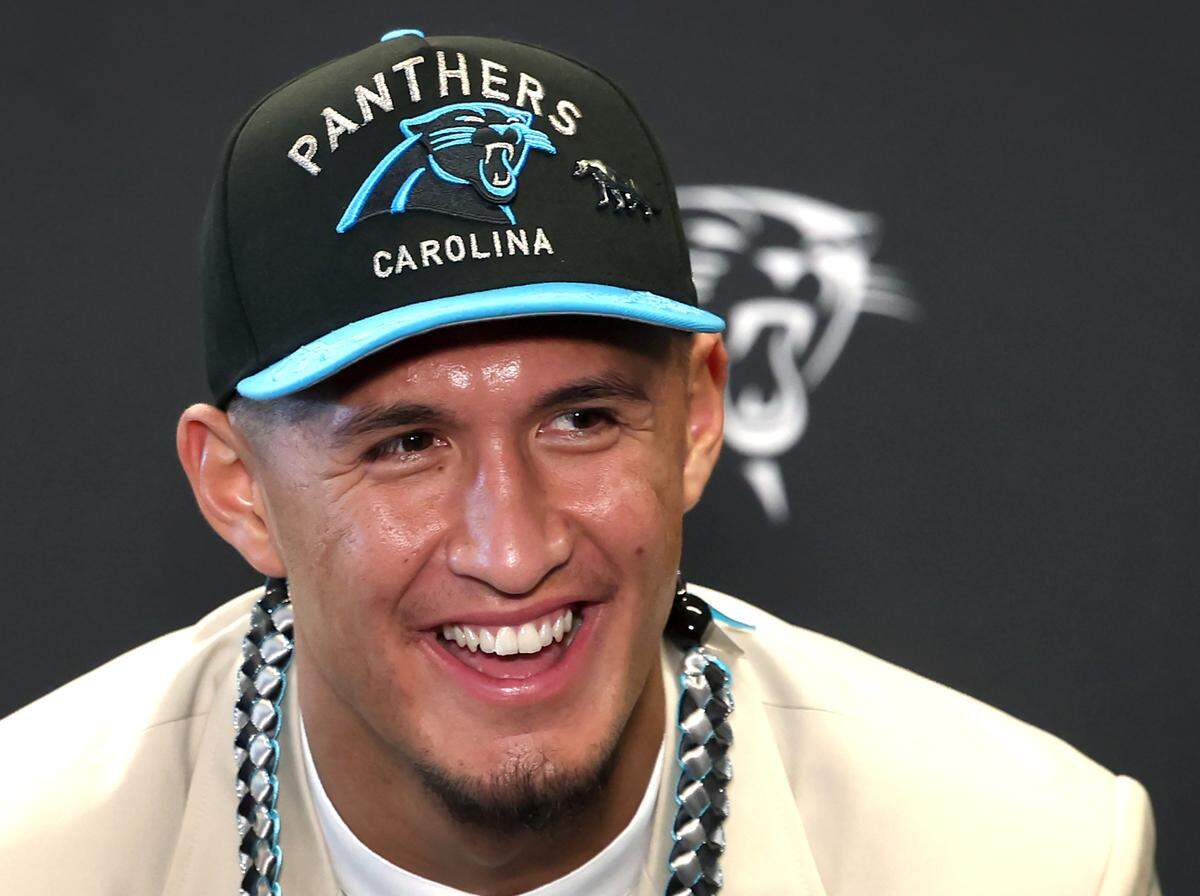 Carolina Panthers draft pick Tetairoa McMillan laughs while responding to a question during a press conference at Bank of America Stadium on Friday, April 25, 2025. The Panthers selected McMillan with the eighth pick in the 2025 NFL Draft.