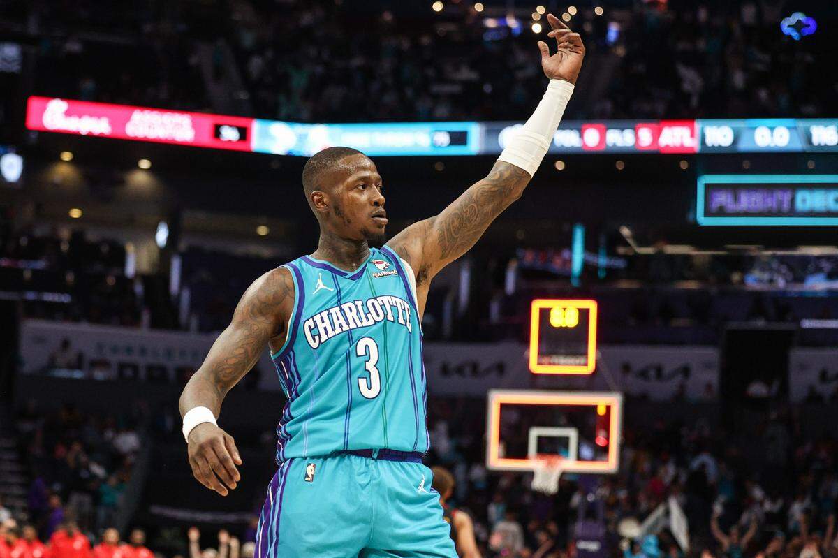 With a six-point lead still in place, Hornets guard Terry Rozier throws his arm up in celebration as the buzzer signals the end of the game against the Hawks at Spectrum Center on Wednesday, October 25, 2023. The Hornets won 116-110.