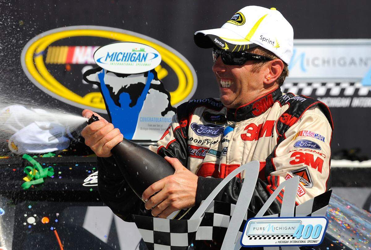 BROOKLYN, MI - AUGUST 19: Greg Biffle, driver of the #16 3M Ford, celebrates in Victory Lane after winning the NASCAR Sprint Cup Series Pure Michigan 400 at Michigan International Speedway on August 19, 2012 in Brooklyn, Michigan. (Photo by Jared C. Tilton/Getty Images)