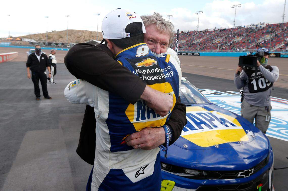 Chase Elliott hugs his father Bill Elliott after winning the season championship during a NASCAR Cup Series auto race at Phoenix Raceway, Sunday, Nov. 8, 2020, in Avondale, Ariz. Bill is also a former series champion. (AP Photo/Ralph Freso)