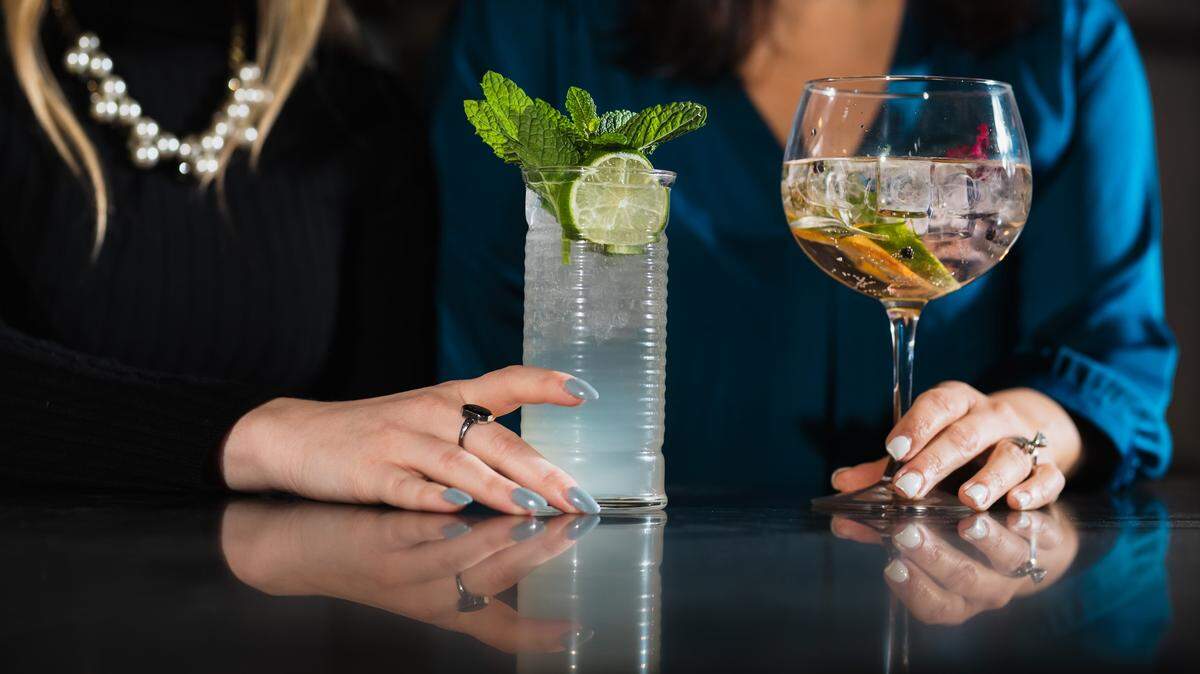 A mojito and pink gin and tonic at Cordial, SouthPark’s new rooftop bar.