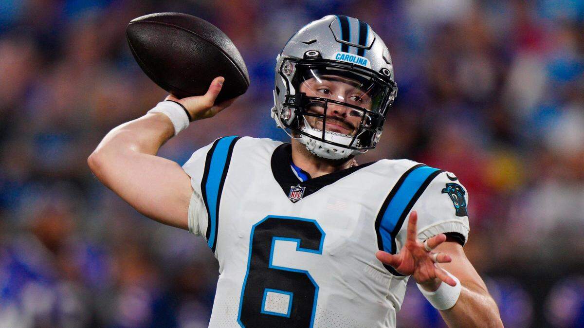 Carolina Panthers quarterback Baker Mayfield passes against the Buffalo Bills during the first half of an NFL preseason football game on Friday, Aug. 26, 2022, in San Diego. (AP Photo/Jacob Kupferman)