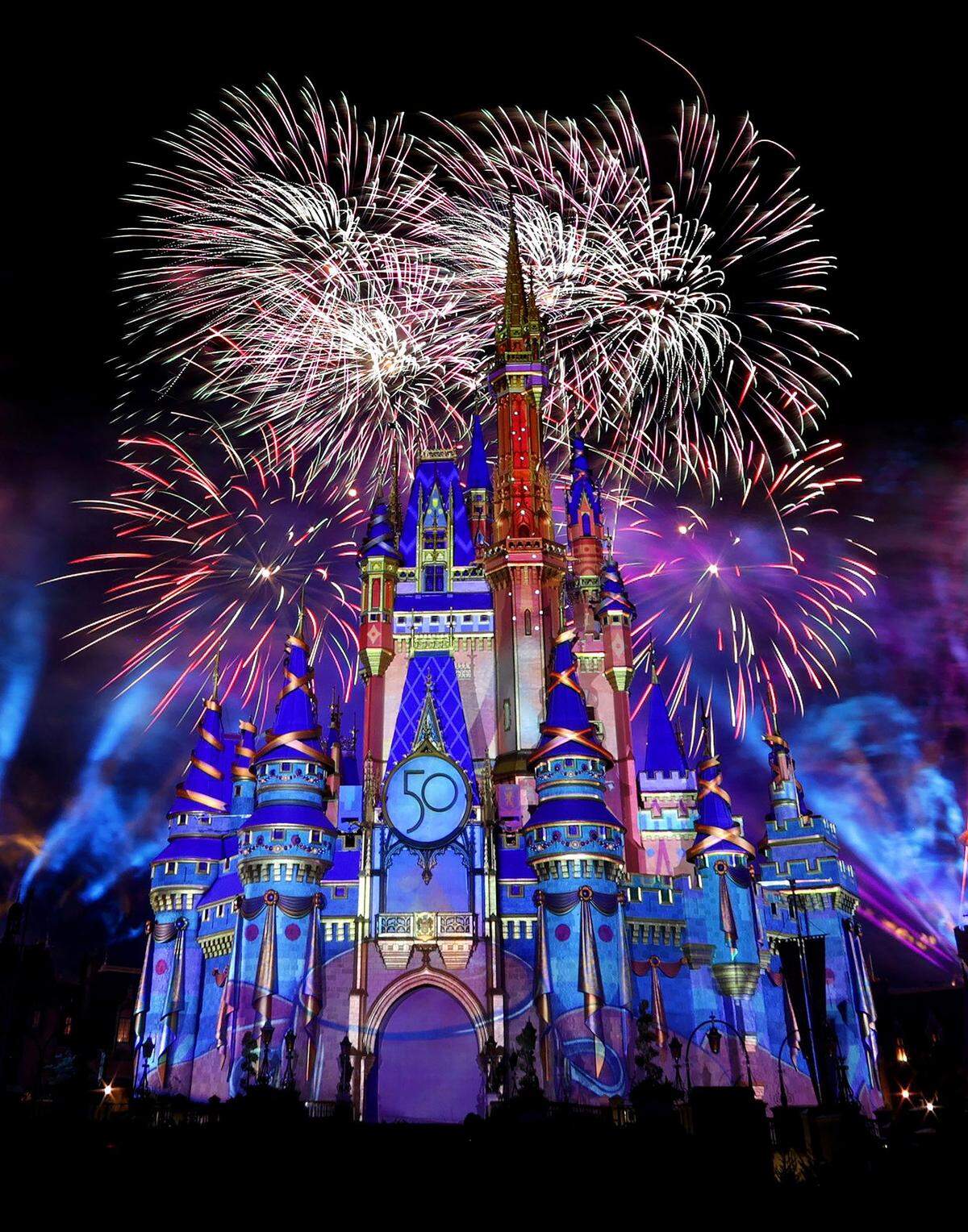 Fireworks illuminate Cinderella Castle at the Magic Kingdom marking the 50th anniversary of Walt Disney World, in Lake Buena Vista, Fla., on Sept. 30, 2021. (Joe Burbank/Orlando Sentinel/TNS)