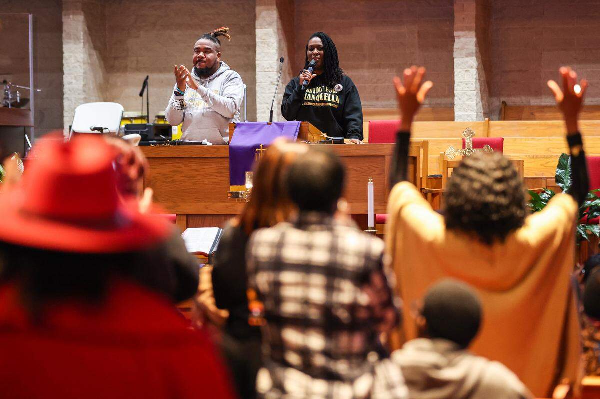From left, Mario Black and Minister Lakeisha Mobley address attendees during a rally for justice for Shanquilla Robinson at Little Rock A.M.E. Zion Church on Saturday. Robinson died during a trip with friends to Mexico in October.