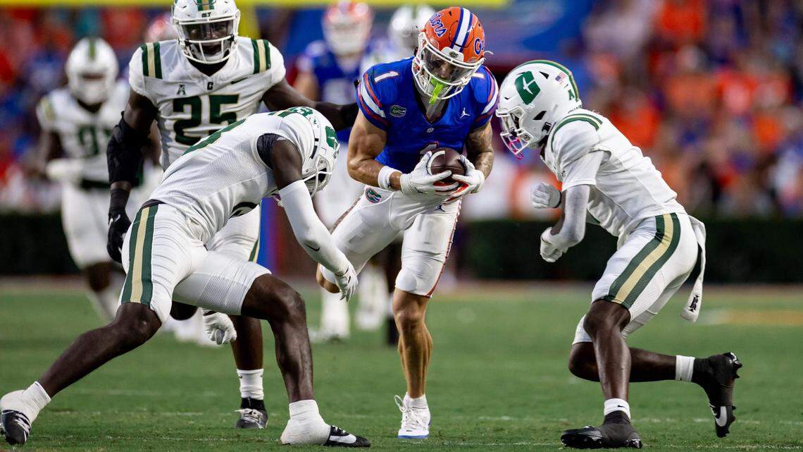 Florida Gators wide receiver Ricky Pearsall is tackled hard after a catch during Saturday’s first half against the Charlotte 49ers at Ben Hill Griffin Stadium. / Matt Pendleton/Gainesville Sun