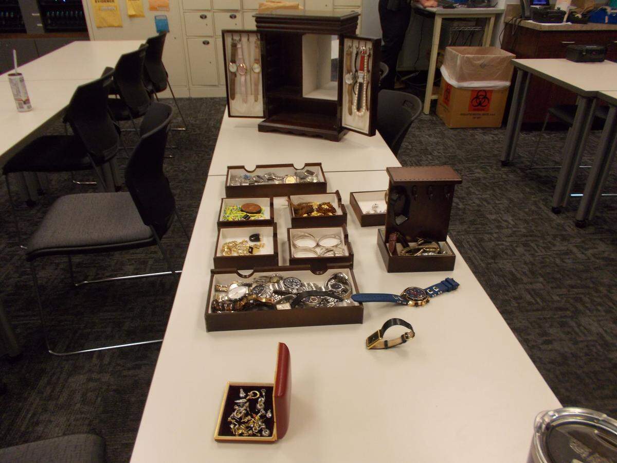 Stolen watches and jewerly recovered by CMPD after it executed a search warrant at a west Charlotte home connected to the accused suspects.