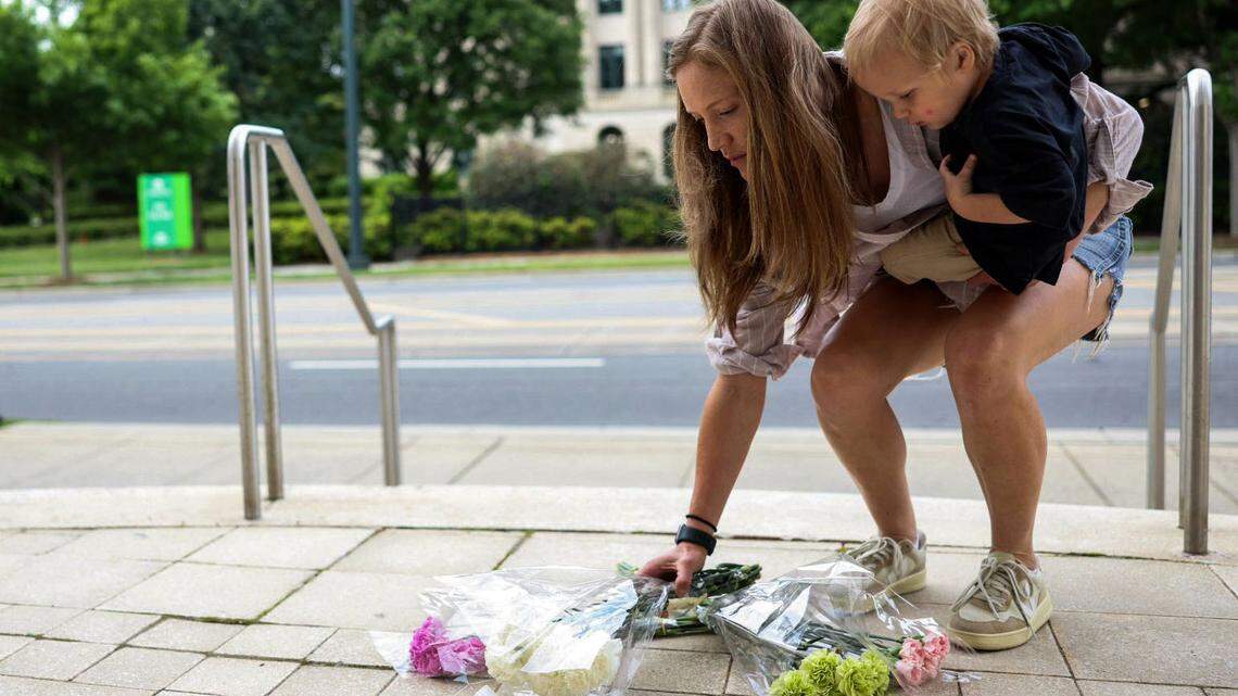 With flowers, food and donations, Charlotte community grapples with officers’ deaths