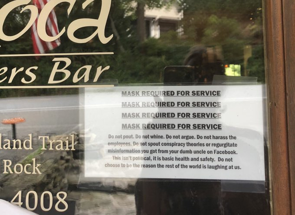 A Blowing Rock restaurant posted a note on its door for customers, letting them know that masks are required.