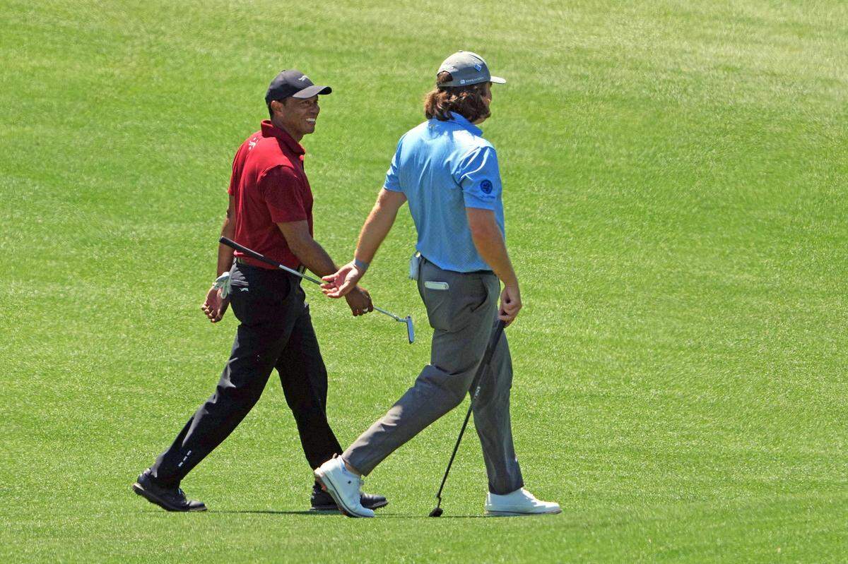 Tiger Woods and Neal Shipley talk on the ninth hole Sunday during the final round of the Masters.