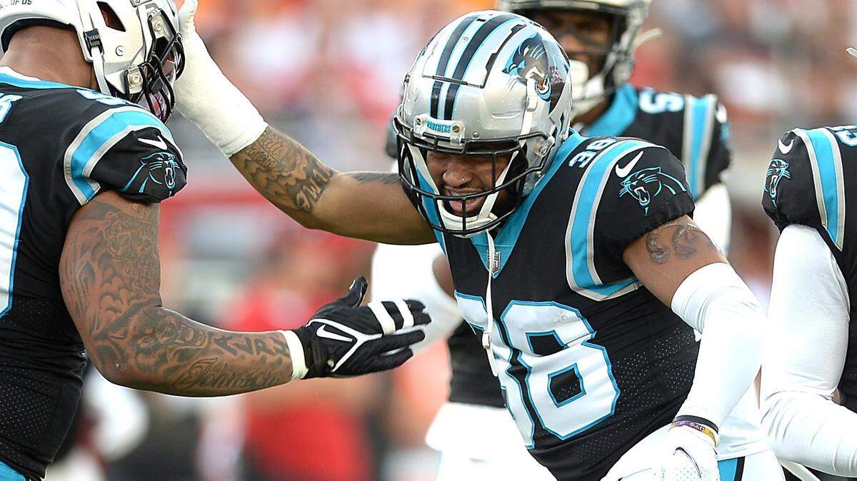 Carolina Panthers safety Myles Hartsfield, right, is congratulated by his teammates after sacking Tampa Bay Buccaneers quarterback Tom Brady during first quarter action at Raymond James Stadium in Tampa, Fl. on Sunday, January 9, 2022.