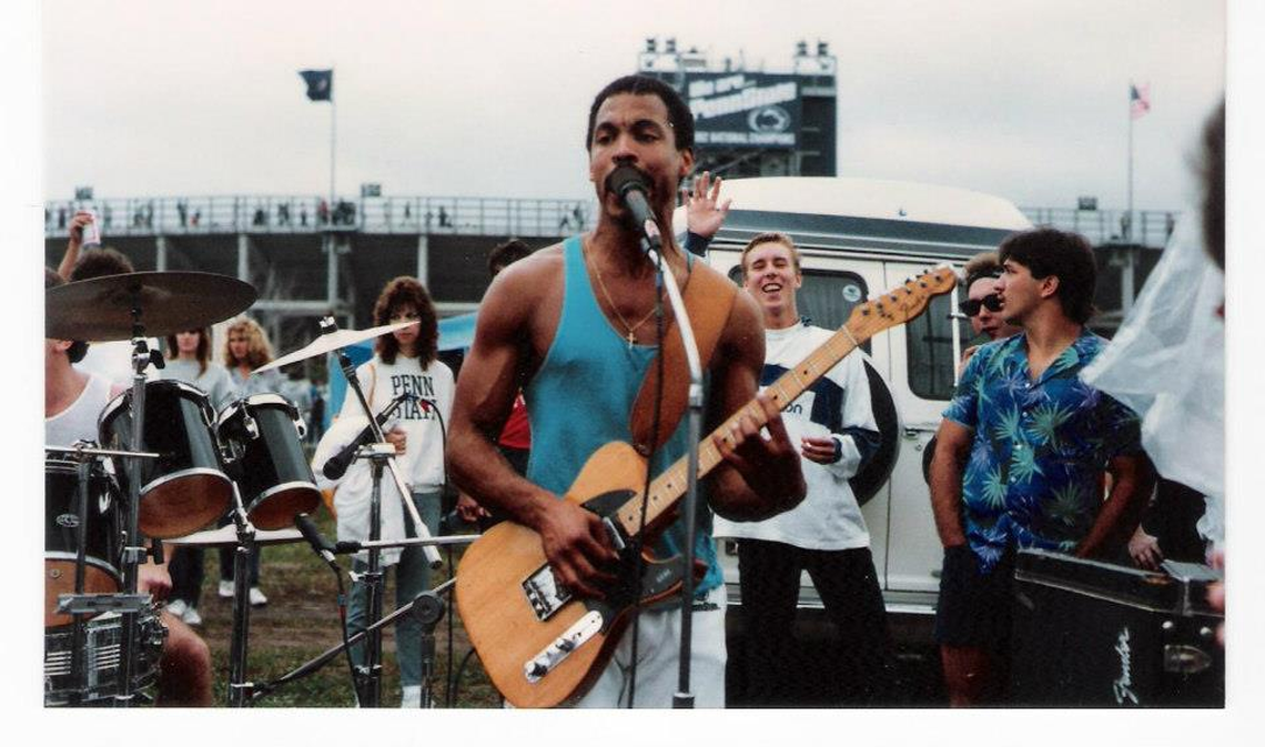 Gene Woods performs at a Penn State tailgate party.