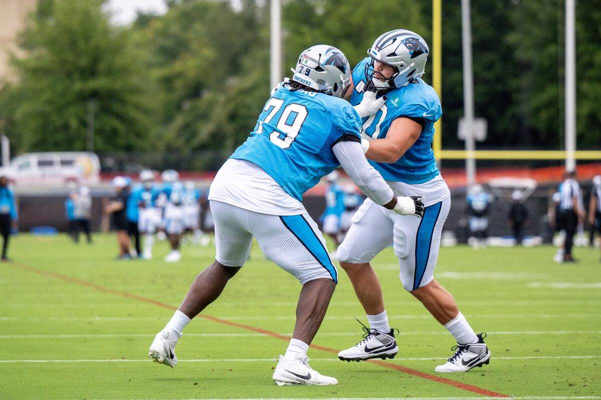 Carolina Panthers tackle Ikem Ekwonu and offensive lineman Brady Christensen practice together during a joint practice session between the Browns and Panthers at the Bank of America Stadium practice fields in Charlotte, NC, Wednesday August 6, 2025.