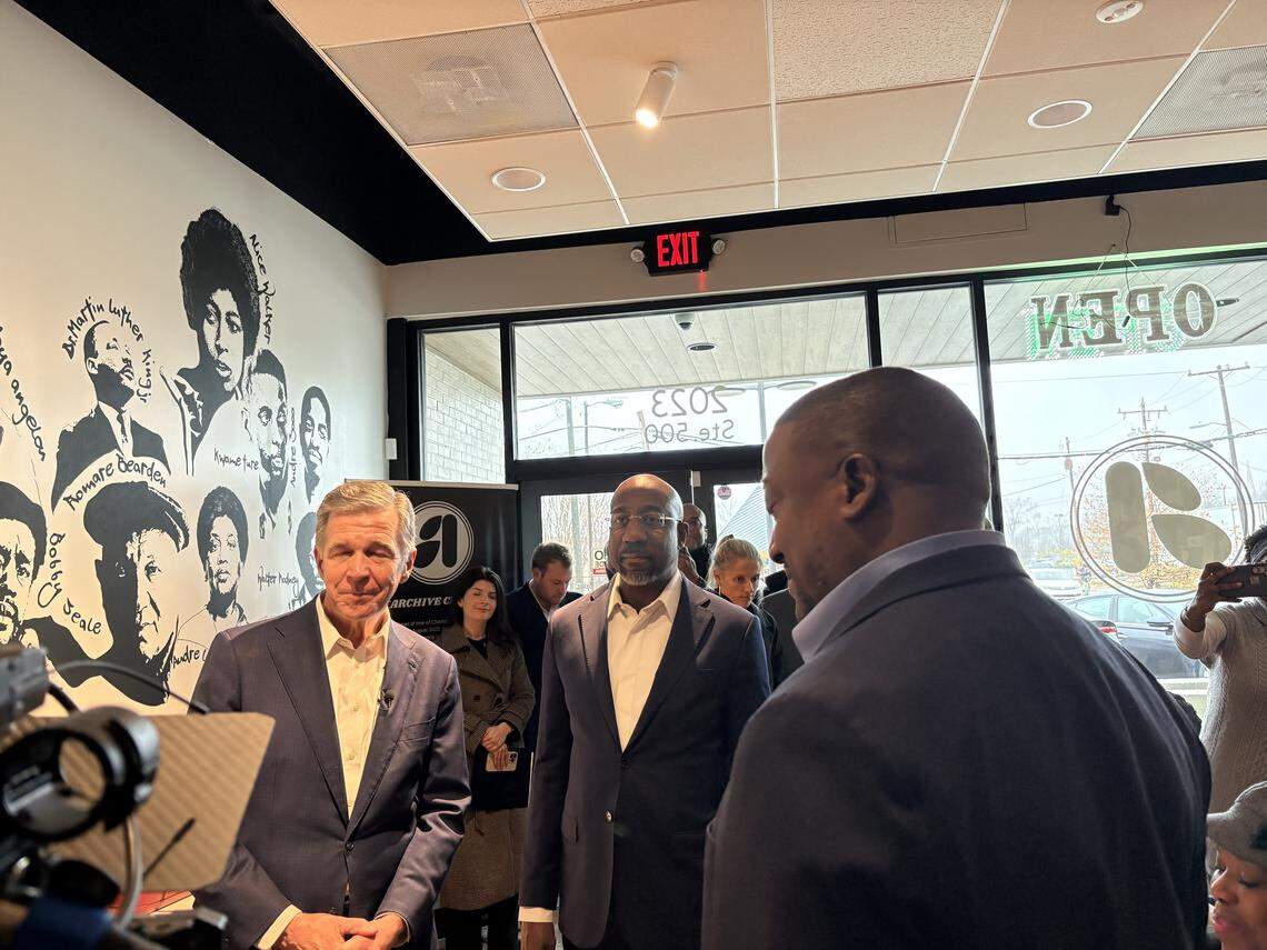 Former North Carolina Gov. Roy Cooper, now running for the U.S. Senate, meets with small business owners at Archive CLT in west Charlotte for a campaign event alongside Georgia Sen. Raphael Warnock on Friday, Dec. 5, 2025.