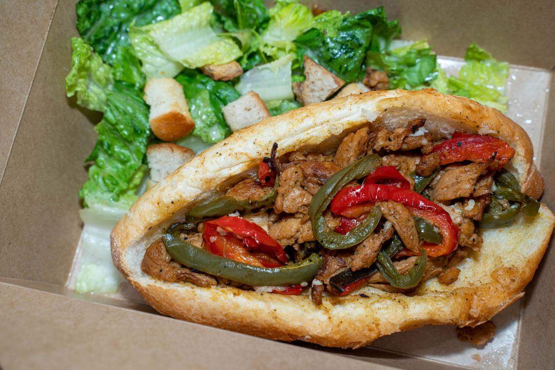 Loving Hut’s vegan Philly cheesesteak with a side Caesar salad.