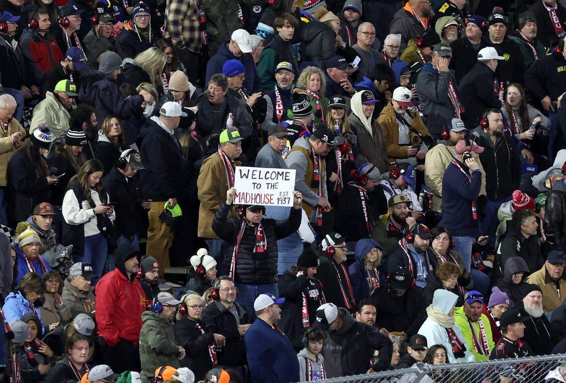 A fan welcomes others to Bowman Gray Stadium during the NASAR Cup Series Last Chance Race in Winston-Salem, NC on Sunday, February 2, 2025. Driver Kyle Larson won the race.