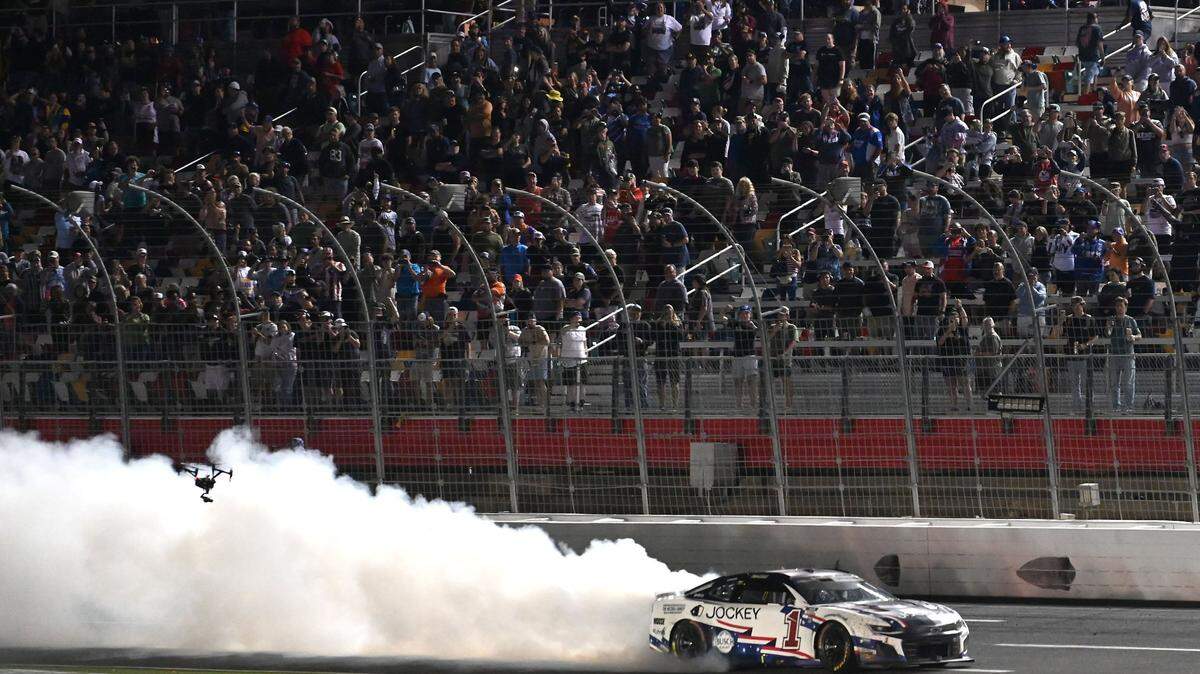 NASCAR Cup Series driver Ross Chastain does a burnout down the front stretch of Charlotte Motor Speedway after winning Sunday’s Coca-Cola 600 in Concord.