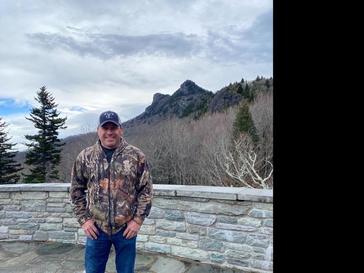 NASCAR driver Ryan Newman poses at the Grandfather Mountain nature park when he took Doc the elk from the park to his Rescue Ranch in Statesville, NC, in April 2022.