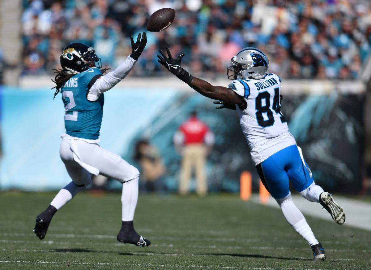 Jacksonville Jaguars safety Rayshawn Jenkins (2) and Carolina Panthers tight end Stephen Sullivan (84) try to get control of a bobbled Panthers pass during first quarter action. The Jacksonville Jaguars hosted the Carolina Panthers at EverBank Stadium in Jacksonville, FL Sunday, December 31, 2023. The Jaguars went in at the half with a 9 to 0 lead.