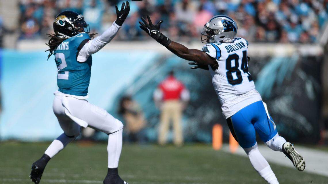 Jacksonville Jaguars safety Rayshawn Jenkins (2) and Carolina Panthers tight end Stephen Sullivan (84) try to get control of a bobbled Panthers pass during first quarter action. The Jacksonville Jaguars hosted the Carolina Panthers at EverBank Stadium in Jacksonville, FL Sunday, December 31, 2023. The Jaguars went in at the half with a 9 to 0 lead.